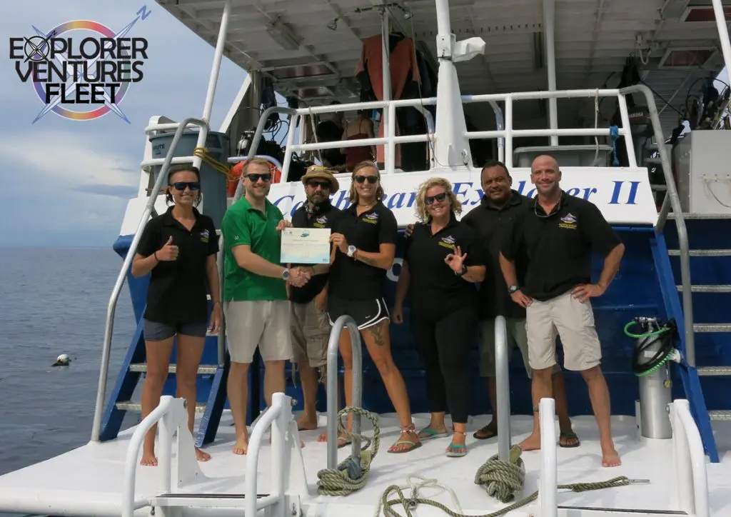 Dive Green: Our Commitment to Conservation | Explorer Ventures Fleet® Caribbean Explorer II crew celebrate the first Green Fins Membership in the liveaboard membership.