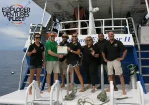 Caribbean Explorer II crew celebrate the first liveaboard Green Fins Membership.