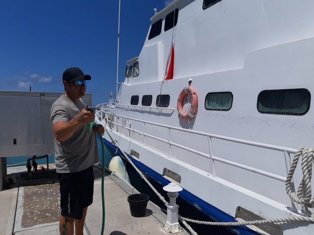 Covid-19 Liveaboard Operations: Our Progress | Explorer Ventures Fleet® Crew cleaning Caribbean Explorer II | Explorer Ventures Fleet